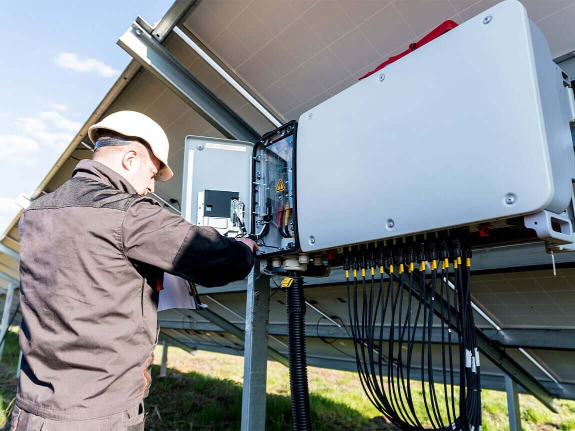 an engineer checking the mppt connected with solar inverter