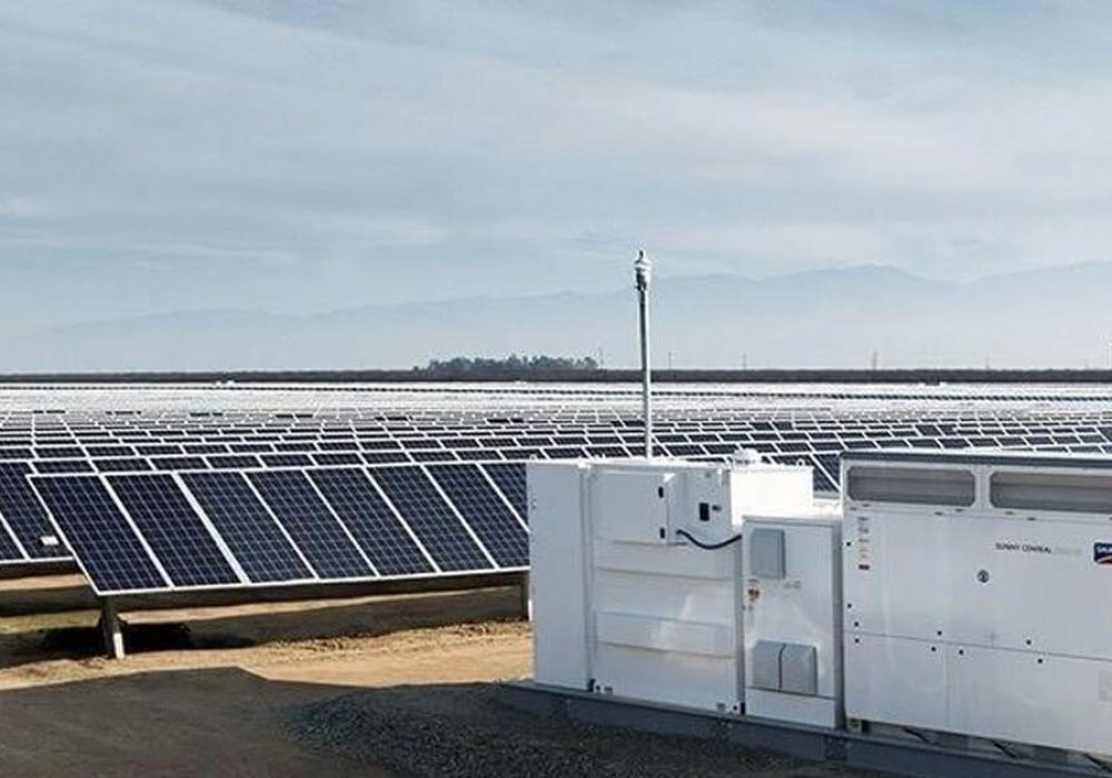 solar panels and a inverter in a vast space of land